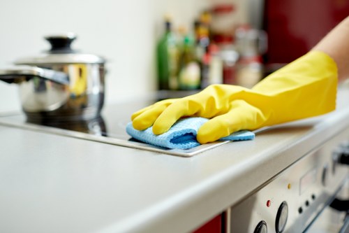 A cleaner tidying a Westminster office during a one off clean