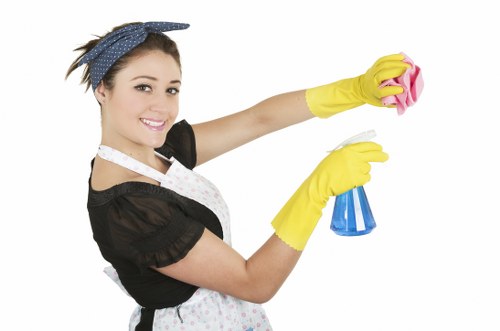 Commercial office cleaning team sanitising a meeting room in Westminster